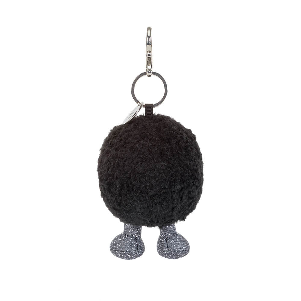 Rear view of a Amuseables Black Hole Bag Charm with legs on a white background