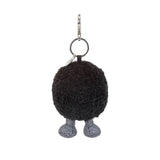 Rear view of a Amuseables Black Hole Bag Charm with legs on a white background