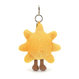 Amuseables Sun Bag Charm is a soft yellow sun-shaped plush keychain with small legs and a metal clip for attaching to bags or keys.