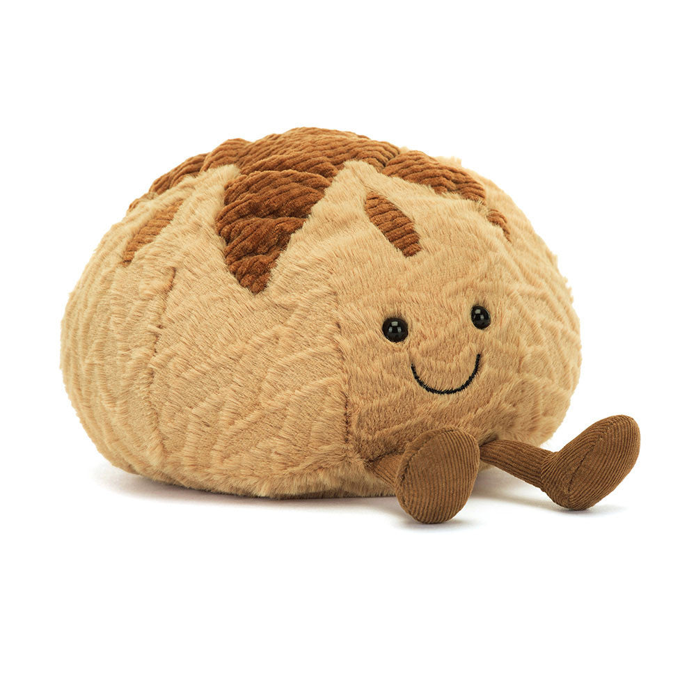 Soft and cuddly Amuseables Sourdough plush toy with a smiling face, textured fabric, and small corduroy legs, perfect for kids and collectors.