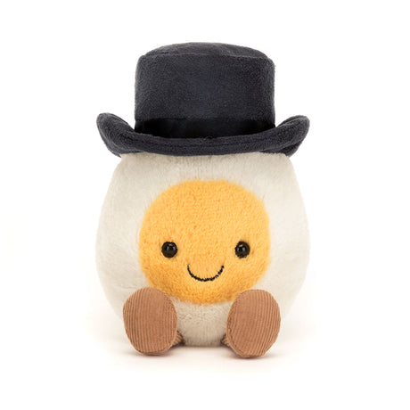 Amuseable Boiled Egg Groom plush toy with a smiling face, soft texture, wearing a black top hat and brown feet, perfect as a kid's birthday gift or toddler toy.