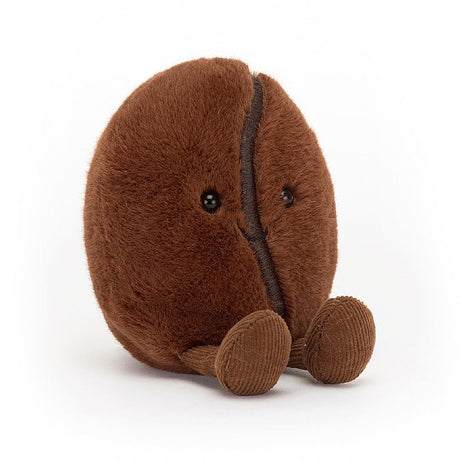 Amuseables Coffee Bean plush toy with soft brown fabric, cute small black eyes, and corduroy-textured feet, designed as a friendly, huggable coffee bean character.