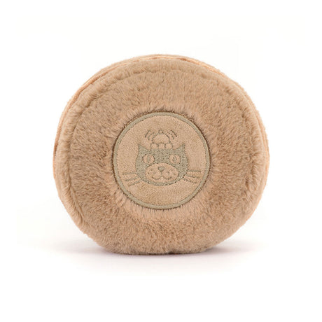 Amuseables Mona Macaron plush toy featuring a round, soft beige design with an embroidered cat face detail, perfect as a cuddly kid's toy gift.