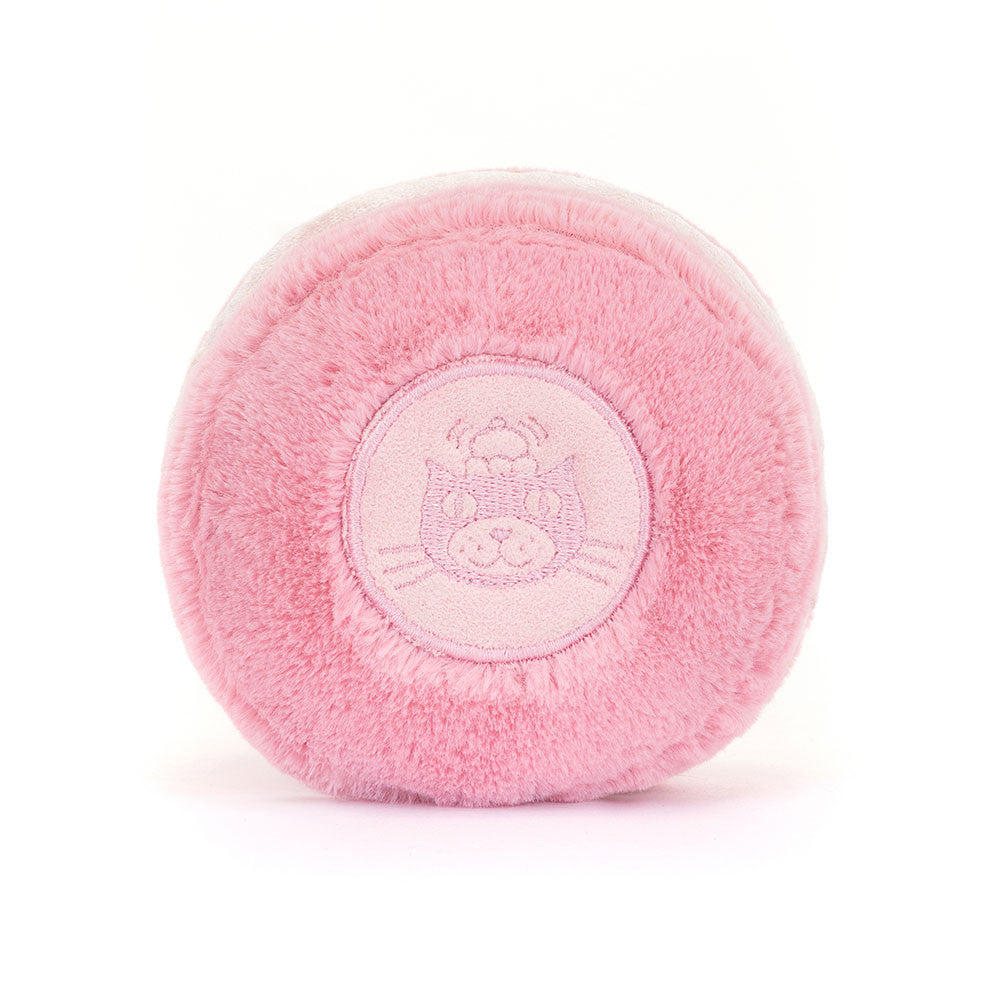 Soft pink plush toy resembling a macaron with a cute embroidered cat face on the side, part of the Amuseables Mia Macaron collection.