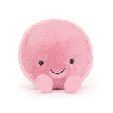 Soft pink round plush toy with a smiling face and small feet, designed as the Amuseables Mia Macaron, perfect as a cute children's plush or kid's birthday gift.