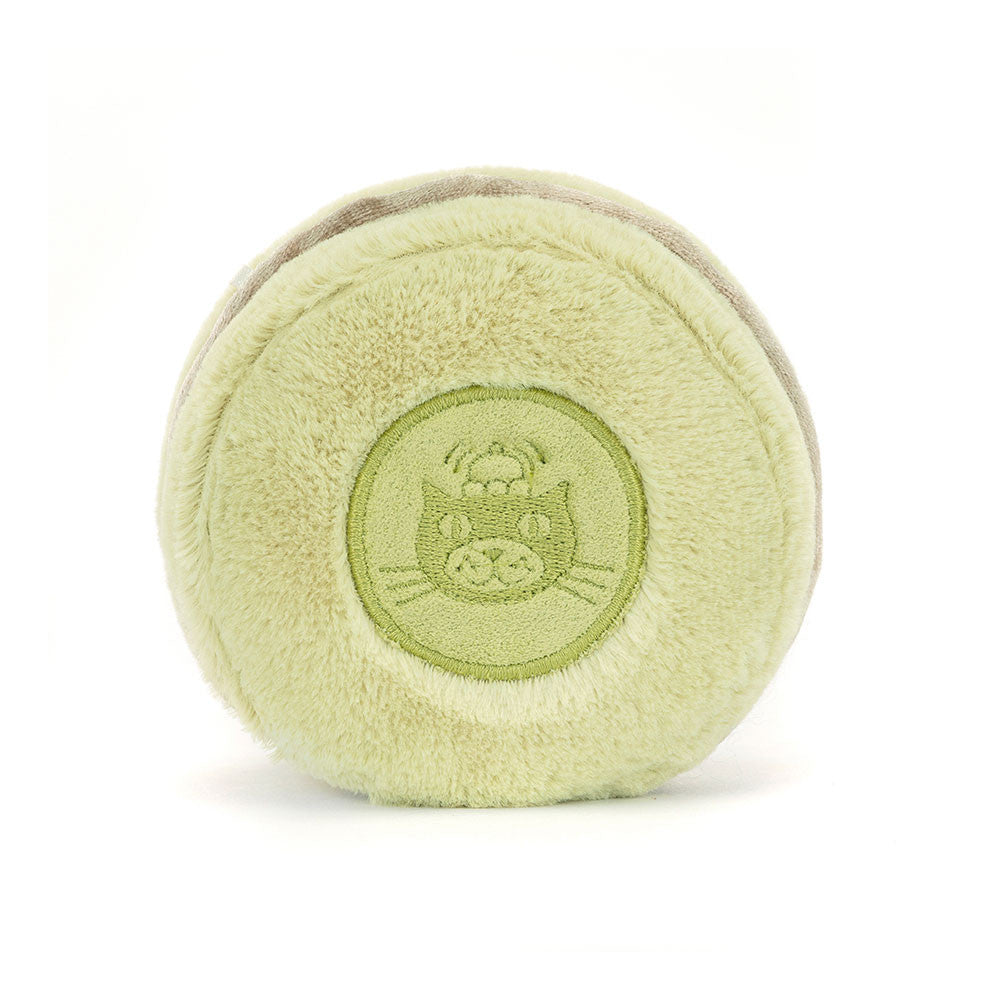 Soft green plush toy shaped like a macaron with an embroidered cat face in the center, designed as the Amuseables Max Macaron for kids.