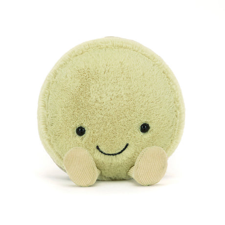 Soft plush toy in the shape of a round macaron with a smiling face and small feet, known as the Amuseables Max Macaron, perfect for a kid’s gift.