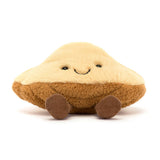 Soft plush toy with a smiling face featuring cream and brown colors and small feet, designed as the Amuseables Margaux Madeleine.