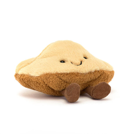 Soft and cuddly Amuseables Margaux Madeleine plush toy designed as a smiling madeleine pastry with cute little legs, perfect for kids and as a charming gift.