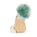 Plush toy designed as a peanut character wearing a light blue hat with a large fluffy green pom-pom, sitting with its feet forward in a soft textured fabric, Amuseables Peanut 'Après Ski'.