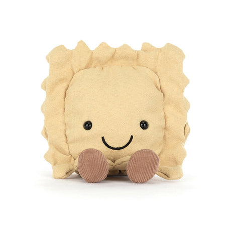 Soft plush toy shaped like a smiling ravioli with ruffled edges and small brown feet, designed as Amuseables Ravioli for playful and cute decor.