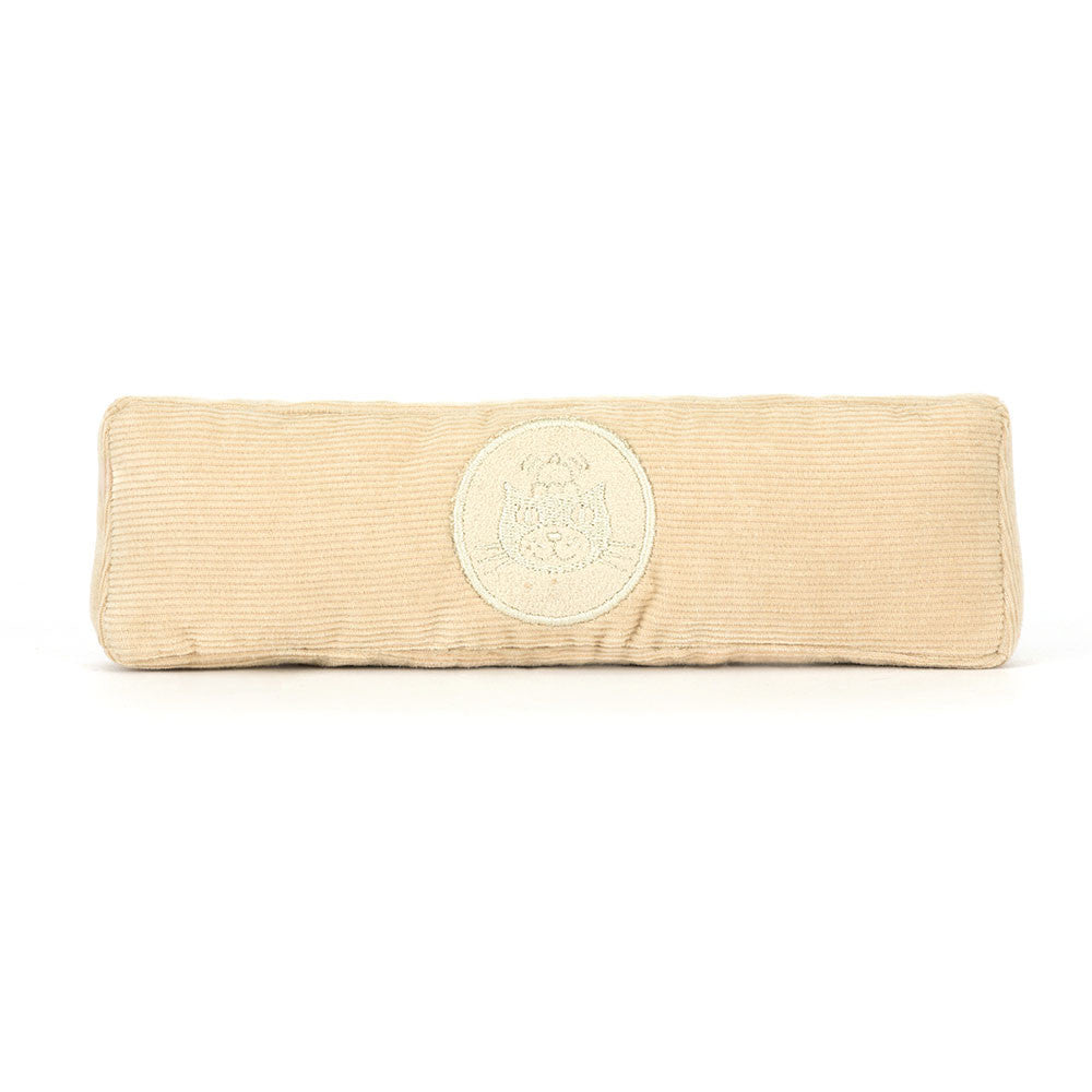 Soft beige corduroy fabric ruler with a circular stitched emblem in the center,  the Amuseables Ruler. 