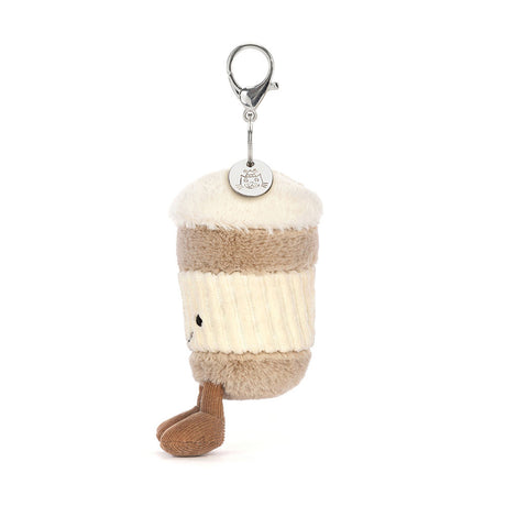 Soft plush charm shaped like a coffee cup with a smiling face and two legs, attached to a keyring, featuring the Coffee-To-Go Charm Amuseables design.