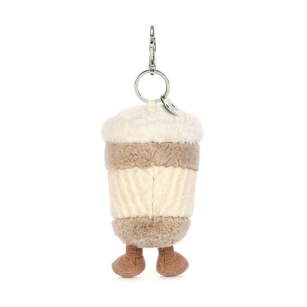 Plush keychain shaped like a coffee cup with cozy fabric textures and small feet attached, designed as the Coffee-To-Go Charm Amuseables for kids and gift lovers.