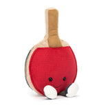 Plush toy shaped like a smiling table tennis paddle with red and beige colors, featuring small black eyes and white feet, representing Amuseable Sports Table Tennis.
