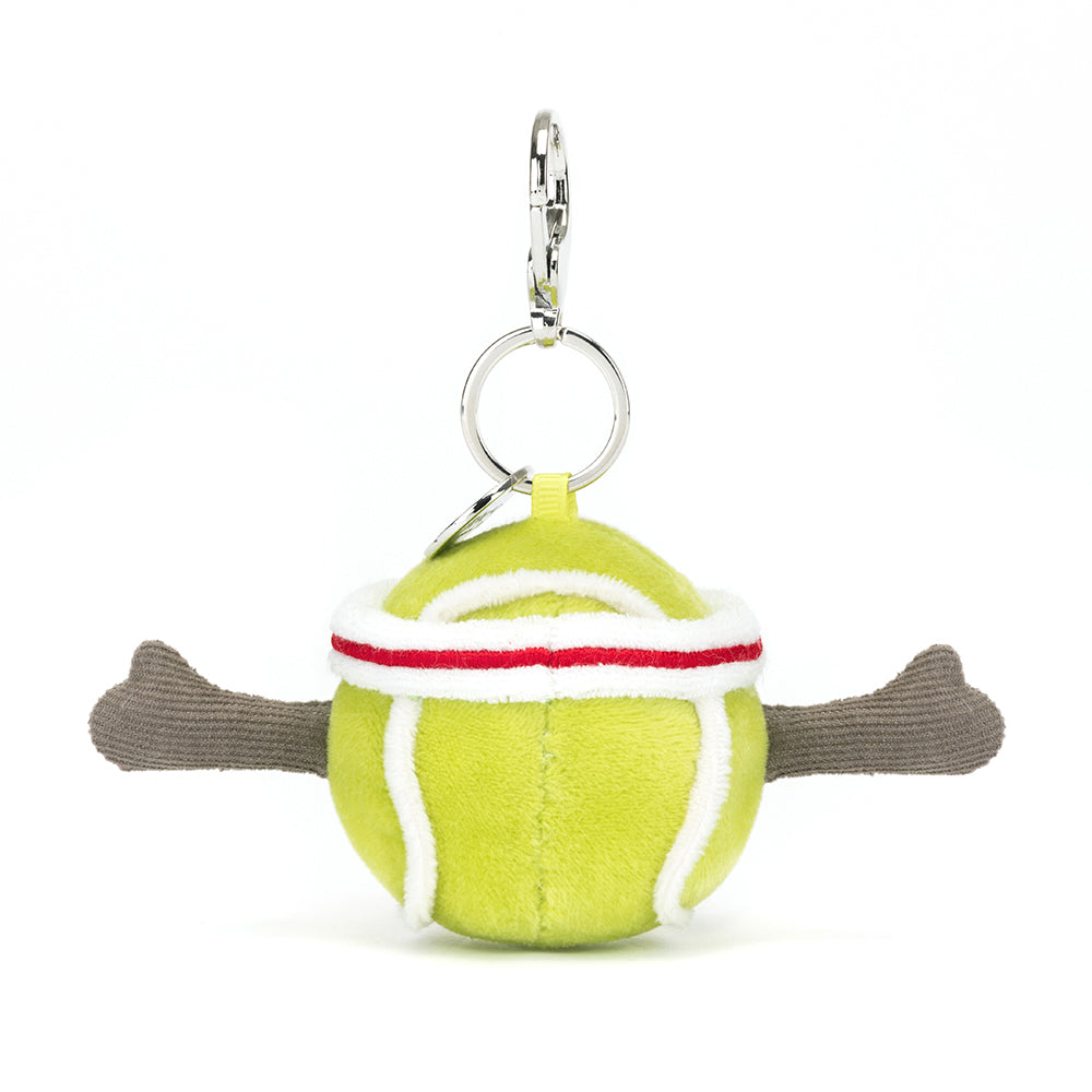 Soft plush tennis ball with white and red stripes, featuring extended brown plush arms, attached to a metal keyring for use as a Sports Tennis Bag Charm.