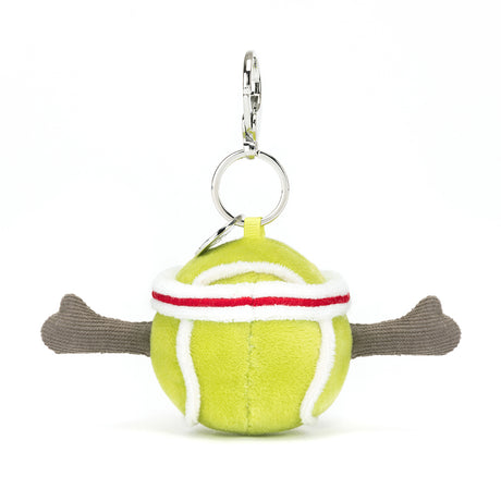 Soft plush tennis ball with white and red stripes, featuring extended brown plush arms, attached to a metal keyring for use as a Sports Tennis Bag Charm.