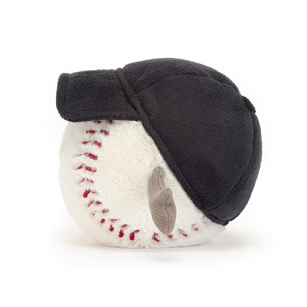 Soft plush toy shaped like a baseball with red stitching, wearing a black baseball cap and featuring small arms, from Amuseables Sports Baseball collection.