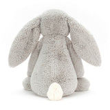 Soft gray plush bunny with long floppy ears and a white fluffy tail, shown from the back, representing the Bashful Silver Bunny Really Big stuffed animal.