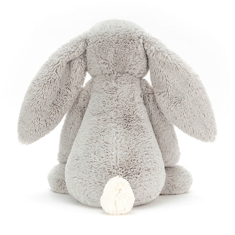 Soft gray plush bunny with long floppy ears and a white fluffy tail, shown from the back, representing the Bashful Silver Bunny Really Big stuffed animal.