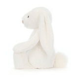 Bashful Luxe Bunny Luna is a soft white plush bunny with long floppy ears and a fluffy tail, perfect as a cuddly toddler toy or kid’s gift.