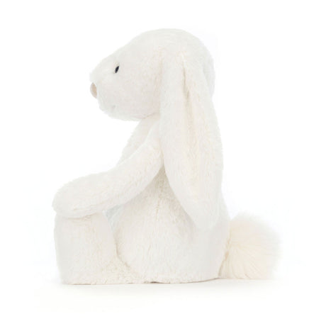 Bashful Luxe Bunny Luna is a soft white plush bunny with long floppy ears and a fluffy tail, perfect as a cuddly toddler toy or kid’s gift.