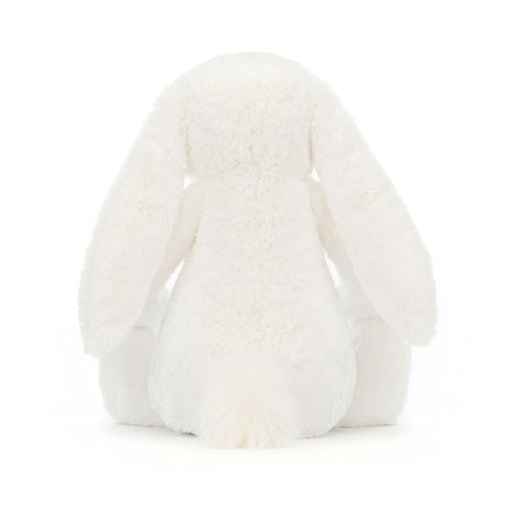 Soft white plush toy with long floppy ears and a fluffy tail, shown from the back, featuring the Bashful Luxe Bunny Luna design.