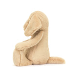 Bashful Luxe Puppy Orlando Huge plush toy sitting on a white background, featuring soft beige fur and floppy ears, perfect for cuddling as a stuffed animal.