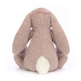Bashful Luxe Bunny Rosa Huge plush toy shown from the back, featuring soft pink fur, long floppy ears, and a fluffy white tail, perfect as a cuddly stuffed animal gift.