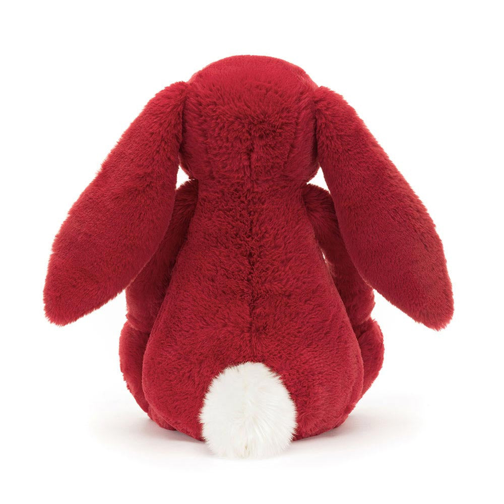 Soft red plush bunny with long floppy ears and a fluffy white tail shown from the back, Bashful Luxe Bunny Scarlett Medium stuffed animal for kids and baby toys.