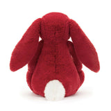 Soft red plush bunny with long floppy ears and a fluffy white tail shown from the back, Bashful Luxe Bunny Scarlett Medium stuffed animal for kids and baby toys.