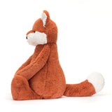 Bashful Fox Cub Really Big plush toy sitting sideways, featuring soft orange fur with white accents, perfect as a cuddly stuffed animal for children.