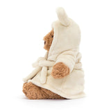 Side view of a Bartholomew Bear Bathrobe Outfit wearing a cream-colored robe on a white background