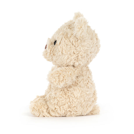 Fluffy beige plush Bartholomew Bear Junior on a white background