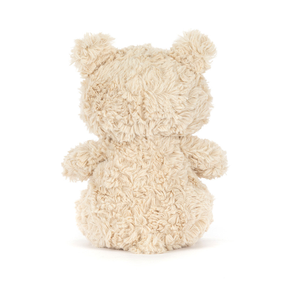 Fluffy beige Bartholomew Bear Junior on a white background
