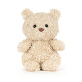 Small beige Bartholomew Bear Junior on a white background