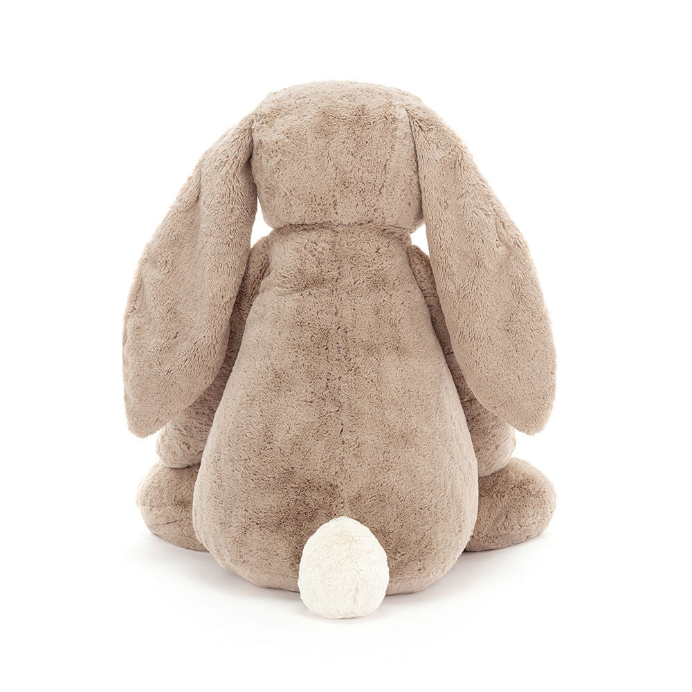 Back view of a large, soft plush toy in beige with long floppy ears and a white fluffy tail, named Bashful Beige Bunny Large, perfect as a toddler toy or stuffed animal gift.