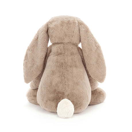 Back view of a large, soft plush toy in beige with long floppy ears and a white fluffy tail, named Bashful Beige Bunny Large, perfect as a toddler toy or stuffed animal gift.