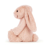 Soft Bashful Blush Bunny Medium plush stuffed animal in light pink with long floppy ears, perfect as a toddler toy or kid’s birthday gift from Grandrabbit's Toy Shoppe.