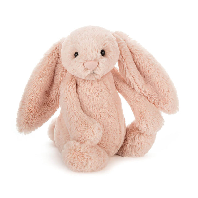 Bashful Blush Bunny Medium is a soft, plush pink stuffed animal with long floppy ears, perfect as a cuddly companion for toddlers and young children.