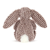 Bashful Luxe Bunny Pine plush toy shown from the back, featuring soft textured brown fabric with long ears and a fluffy white tail.