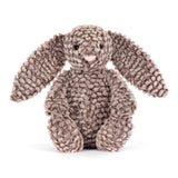 Soft and textured plush bunny toy with long floppy ears and a gentle expression, designed as Bashful Luxe Bunny Pine, perfect for cuddling and toddler play.