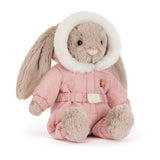 Soft plush bunny toy dressed in a pink cozy outfit with a furry hood, sitting upright, perfect as a cuddly companion or kid's gift called Bashful Bunny 'Snow Suit'.