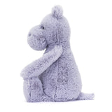 Soft and cuddly plush toy in light lavender color, shaped like a sitting hippo with a gentle expression, called Bashful Hippo, perfect as a toddler gift.