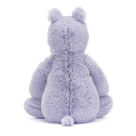 Soft lavender plush stuffed animal shown from the back with rounded ears and a small tail, named Bashful Hippo, designed as a cuddly toddler toy.