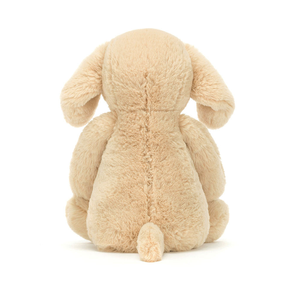 Soft and cuddly Bashful Luxe Puppy Orlando Medium plush toy shown from the back, featuring light beige fur and floppy ears, perfect as a kid's birthday gift or toddler toy.