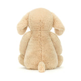 Soft and cuddly Bashful Luxe Puppy Orlando Medium plush toy shown from the back, featuring light beige fur and floppy ears, perfect as a kid's birthday gift or toddler toy.