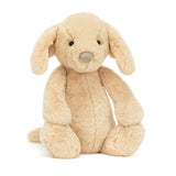 Soft and cuddly beige plush puppy sitting upright with floppy ears and a stitched nose, perfect as a comforting companion for children, Bashful Luxe Puppy Orlando Medium.