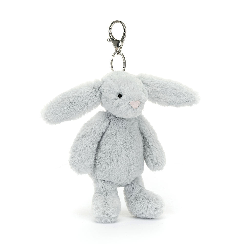 Bashful Silver Bunny Bag Charm made of soft silver-gray plush fabric with long floppy ears, black eyes, and a pink nose, featuring a silver clasp for attaching to bags or backpacks.