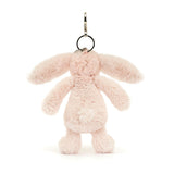 Bashful Blush Bunny Bag Charm featuring a soft, blush pink plush bunny with long ears, a round tail, and a metal clip for attaching to bags or keys.